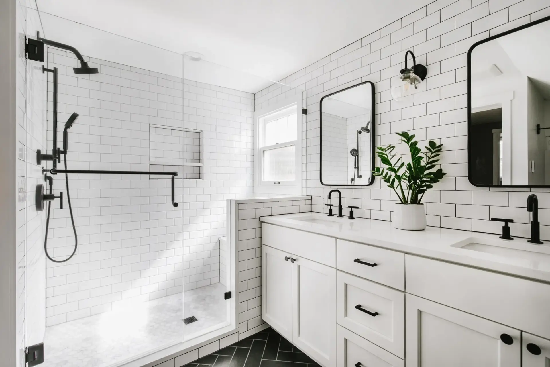 Modern farmhouse style bathroom remodel with white tile and warm wood vanity